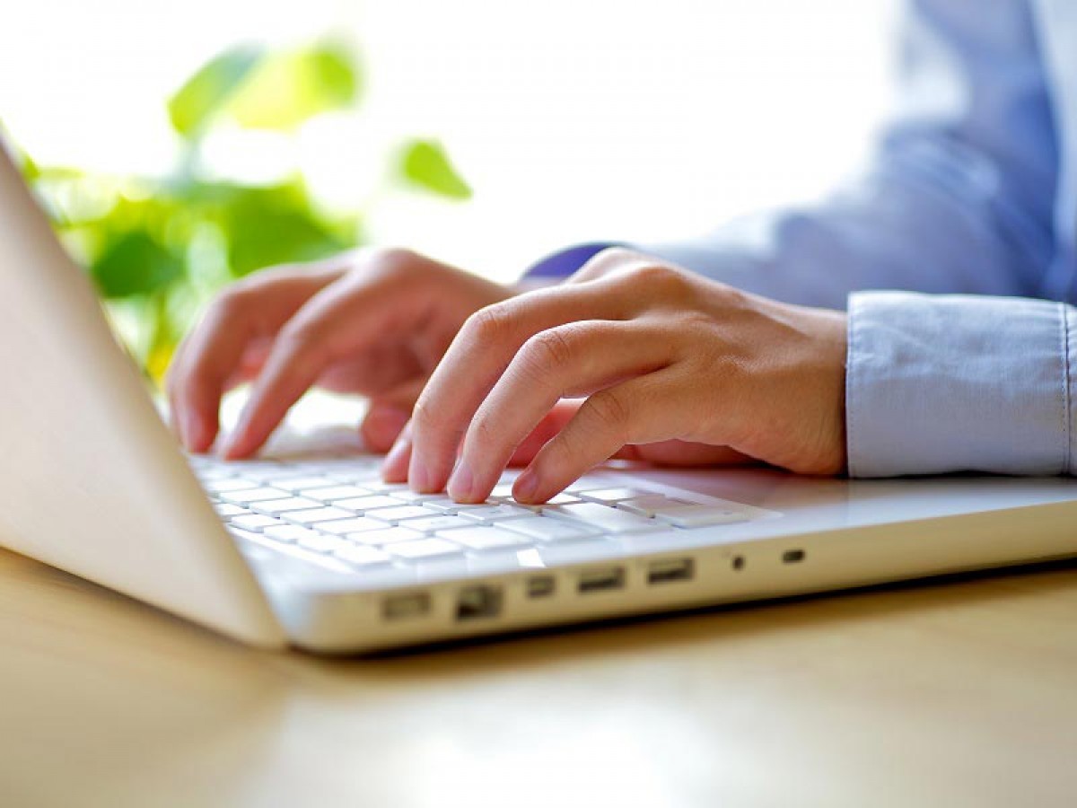 Man typing on laptop