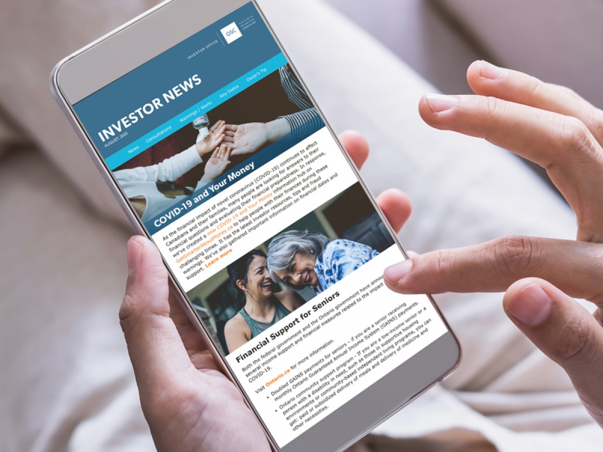 Person scrolling through Investor News newsletter on their phone