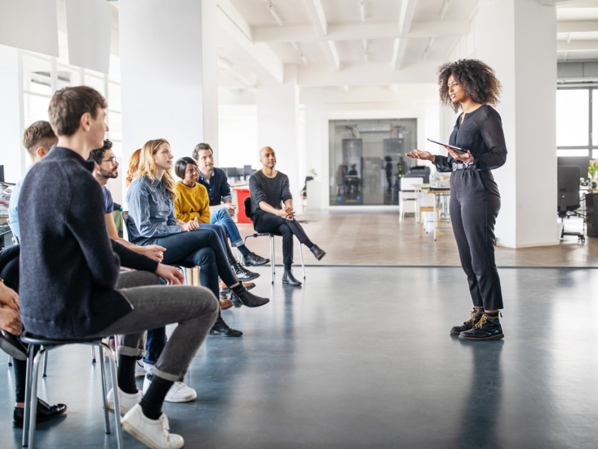 Woman giving presentation to audience