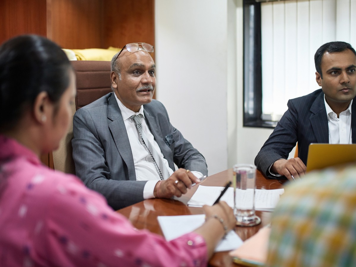 South Asian senior man at meeting