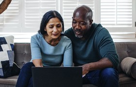 couple looking at laptop