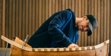 Alex Labelle, Métis craftsman, working on the small-scale birchbark canoe that symbolizes our Truth and Reconciliation journey.