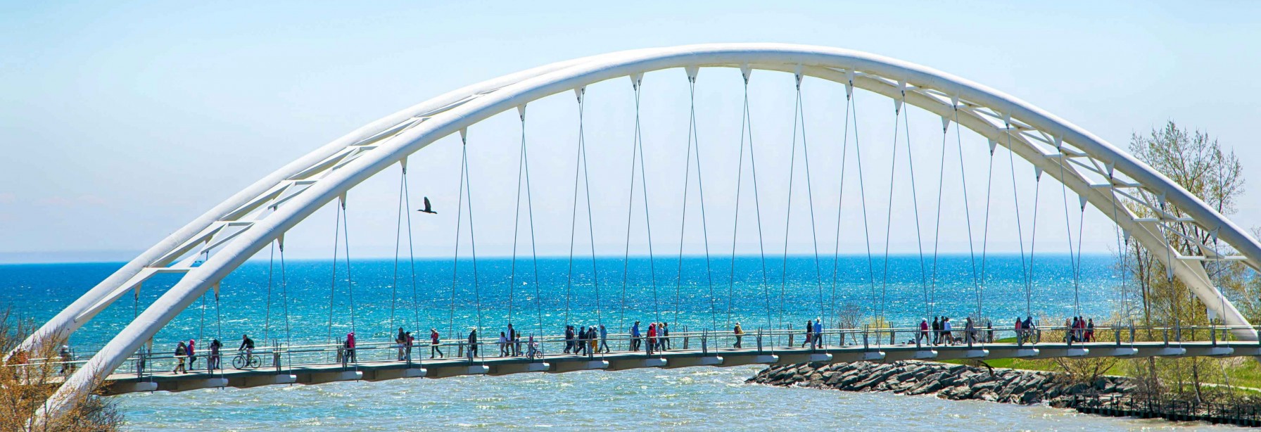 Humber Bay Arch Bridge with people walking across