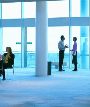 People in office by window