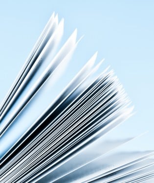 Stack of papers on a blue background