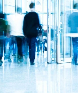 People walking in a building lobby