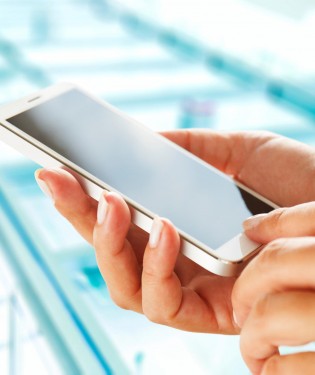 Woman's hand holding mobile phone